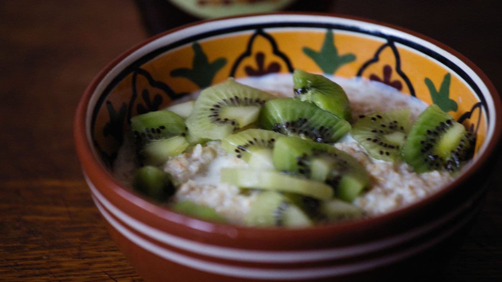 A bowl of oatmeal with fruit - Can Dogs Eat Oatmeal? Plain Cooked Only