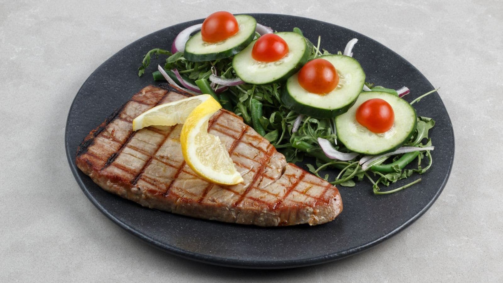 Grilled tuna steak with salad - Can Dogs Eat Tuna? Occasional Only